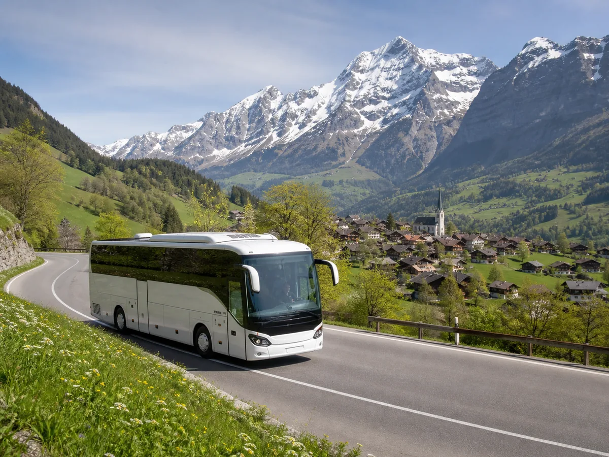 Touring coach travelling through a Swiss alpine valley
